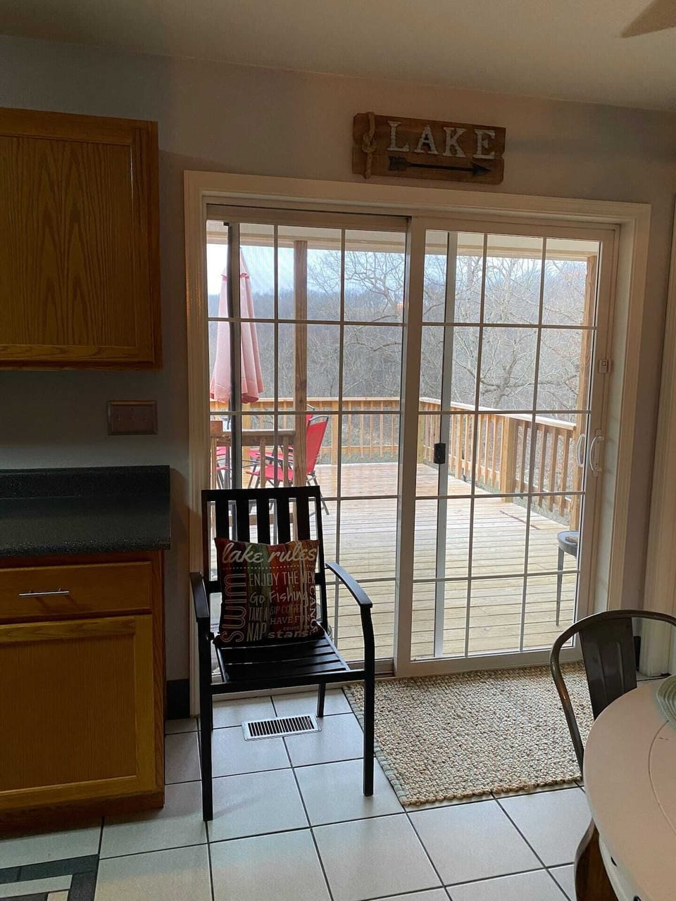 Sliding glass doors off kitchen/dining area lead to back deck