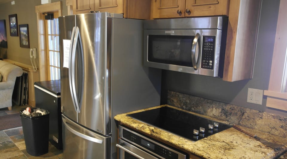 Shared kitchen area for guests and family down by the pool.