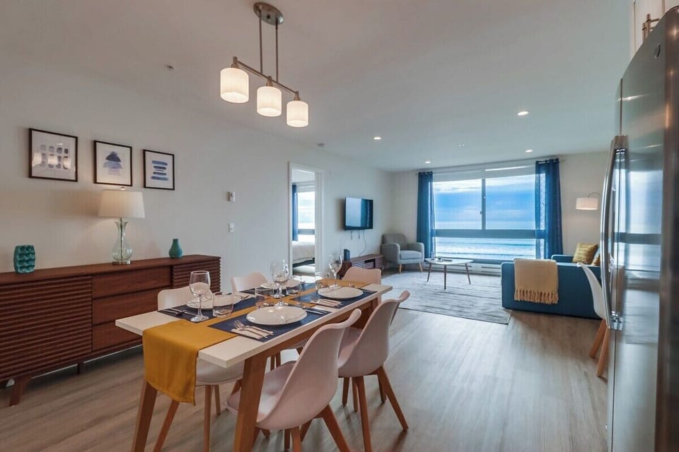 Dining + living space from kitchen with peek into master bedroom