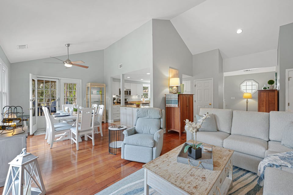 Thoughtful coastal décor and warm wood floors add character, while the open flow connects easily to the rest of the home for effortless entertaining.