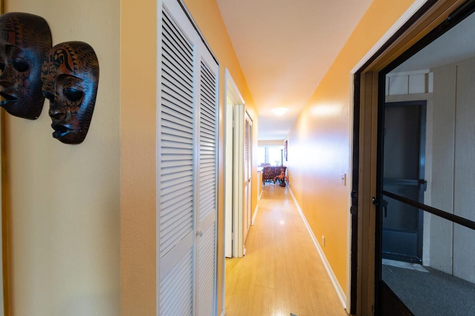 Hallway from entry door into kitchen and living room