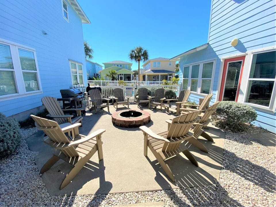 Cozy fire pit area with Adirondack chairs for evening gatherings.