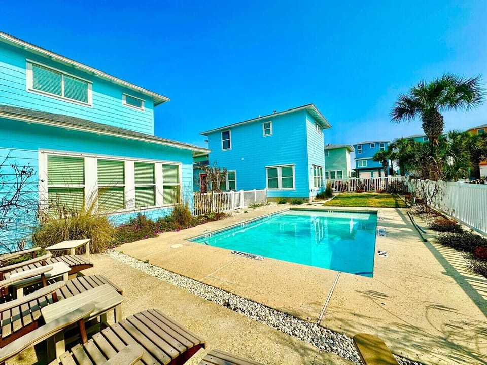 Private pool surrounded by sun loungers.