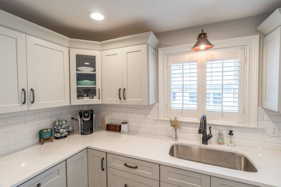 Beverage area equipped with a Keurig coffee maker, k-cups, creamer,  sugar, a selection of teas, with honey sticks!
