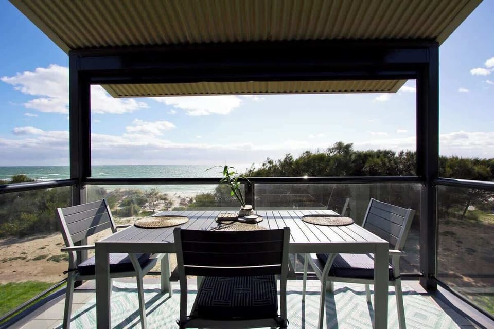 Balcony with outdoor furniture with sunshield blind for late afternoons so you can still enjoy sitting on the balcony