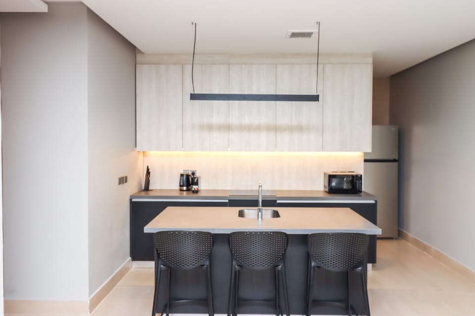 Apartment, 3 Bedrooms | Private kitchenette | Fridge, microwave, oven, coffee/tea maker