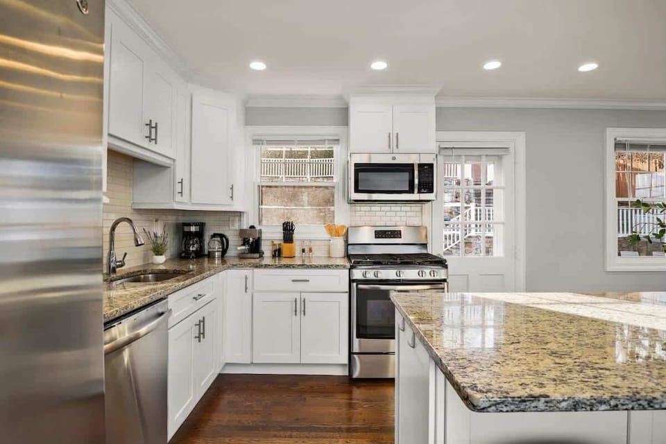 Kitchen including coffee and espresso machine