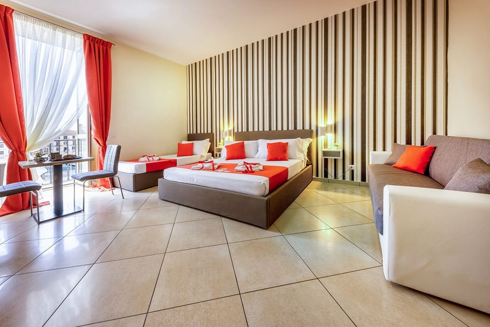 Panoramic Quadruple Room | Minibar, in-room safe, desk, laptop workspace