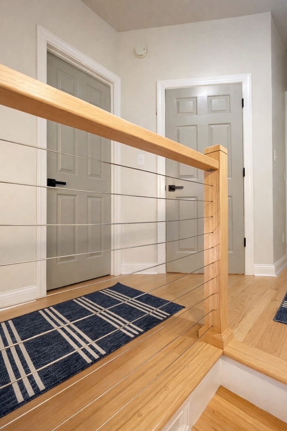Top floor looking at the bathroom and bedroom doors