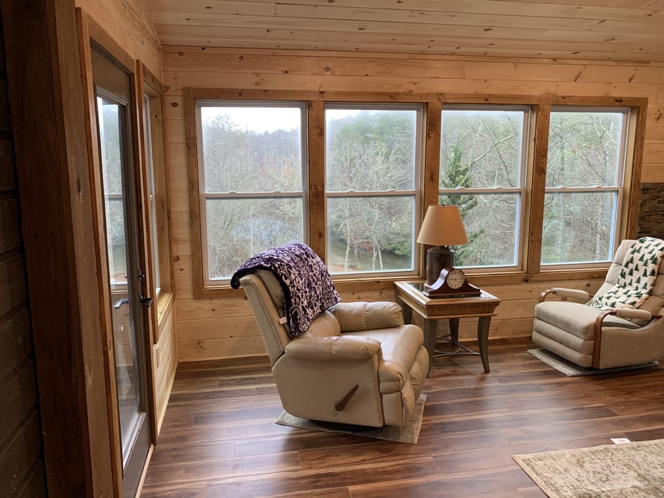 New sun room with view of river, deer and wild turkey grazing on lower plateau