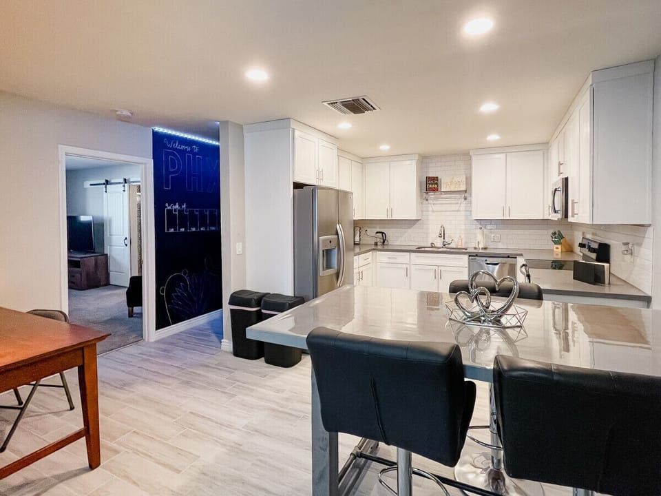 Kitchen with Breakfast Nook opens up to work space, Game Hallway, and Owner`s Suite