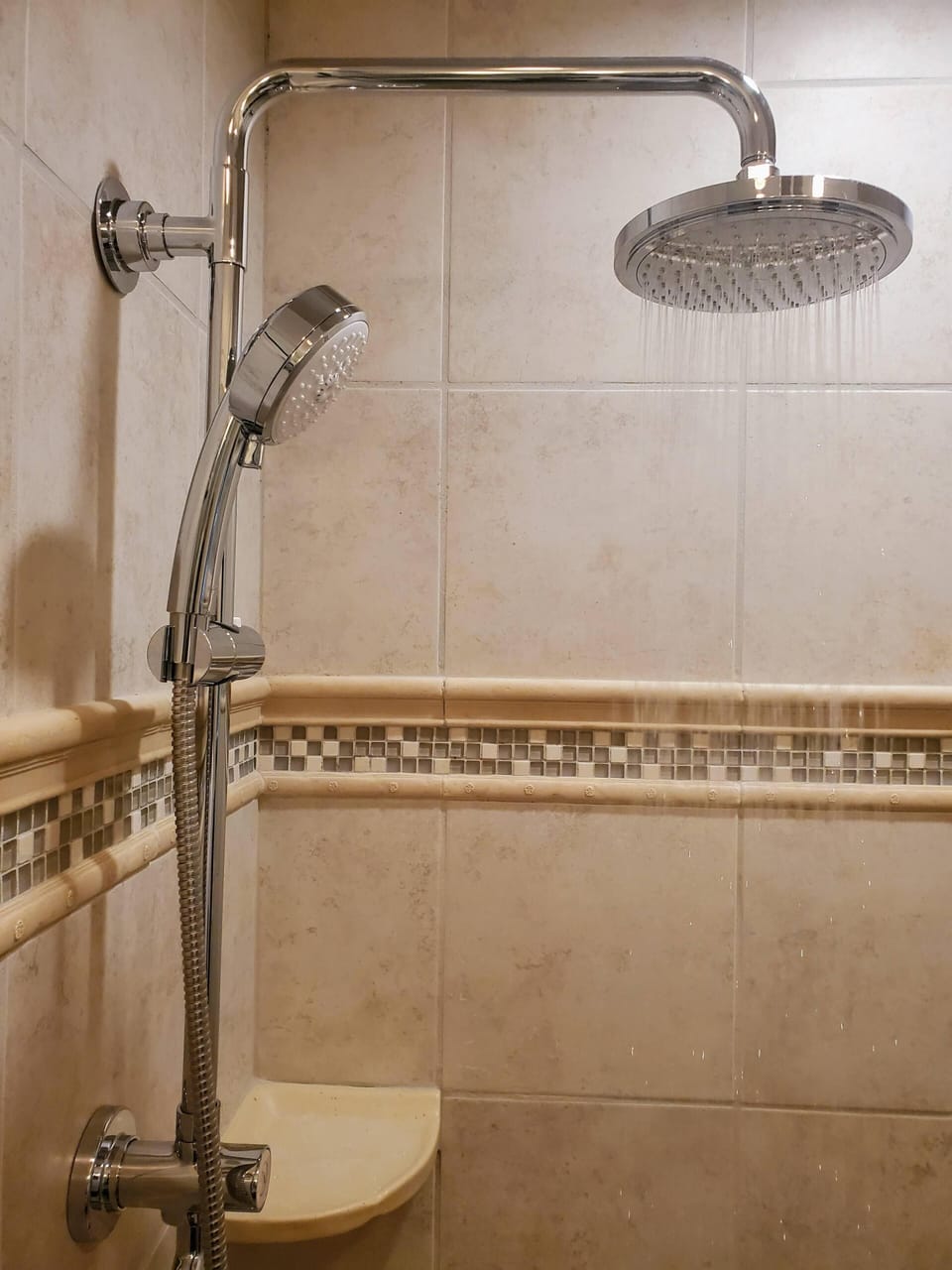 Rain shower in primary bedroom on suite bath room. 