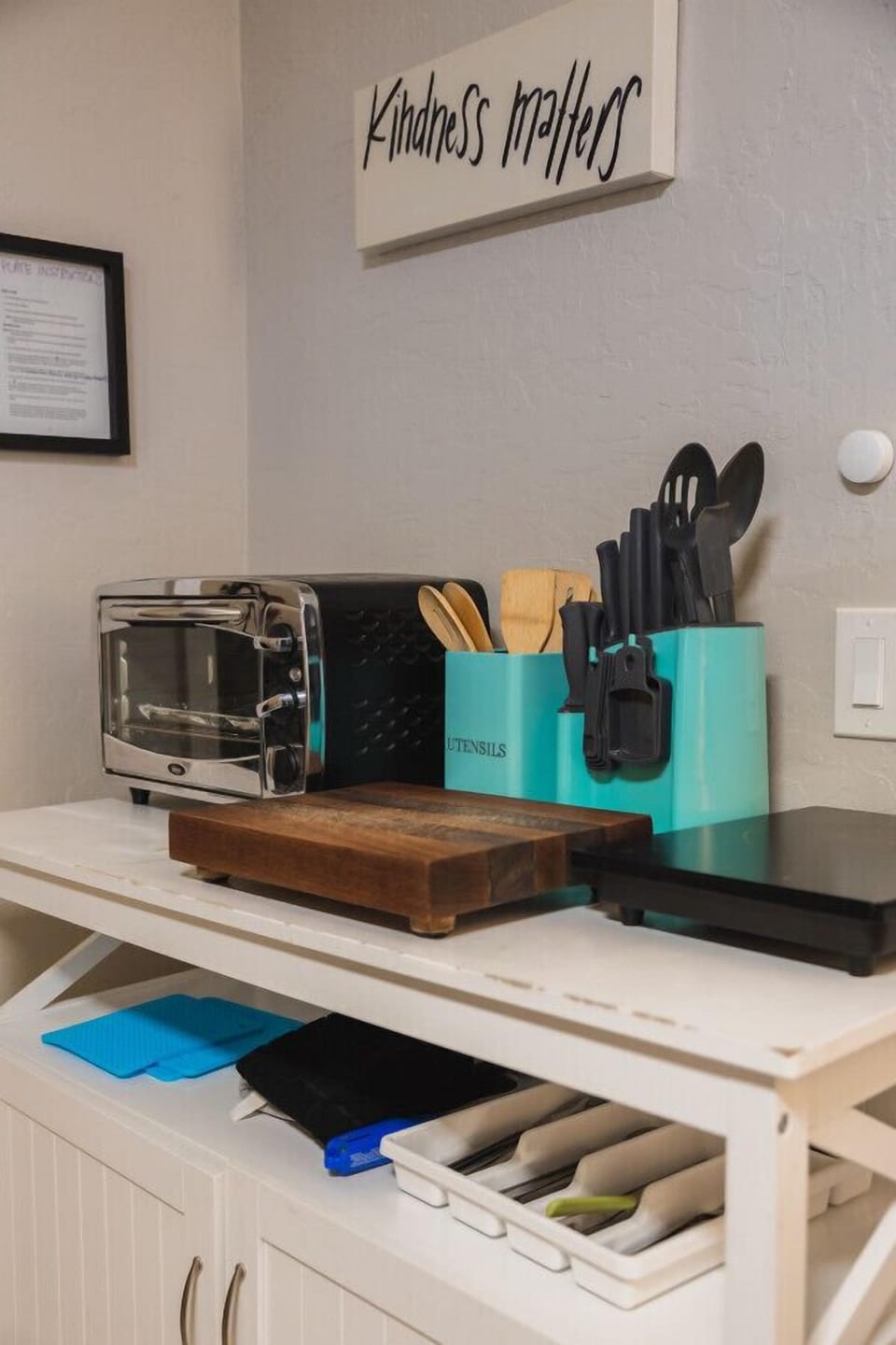 The other side of the Kitchenette includes a toaster oven, hot plate, cutting board, utensils and other supplies!