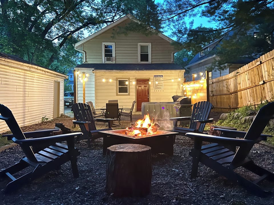 Secluded outdoor fire pit space. Patio with grill and 6 person hot tub. 