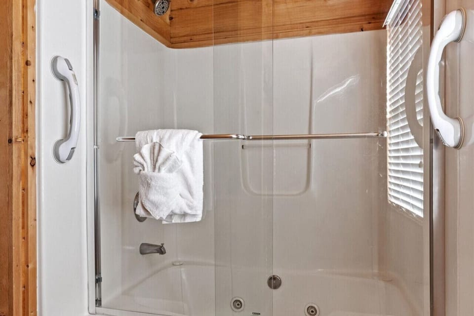 Downstairs bathroom - bathtub/shower with glass doors