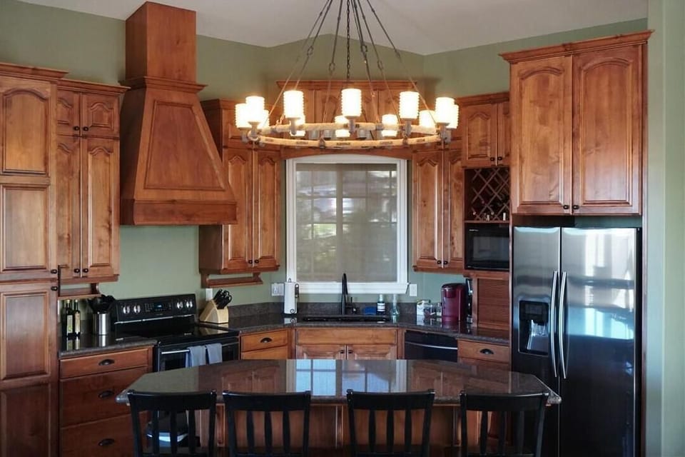 Large kitchen will all the modern amenities. Large gathering island w/ 4 chairs.