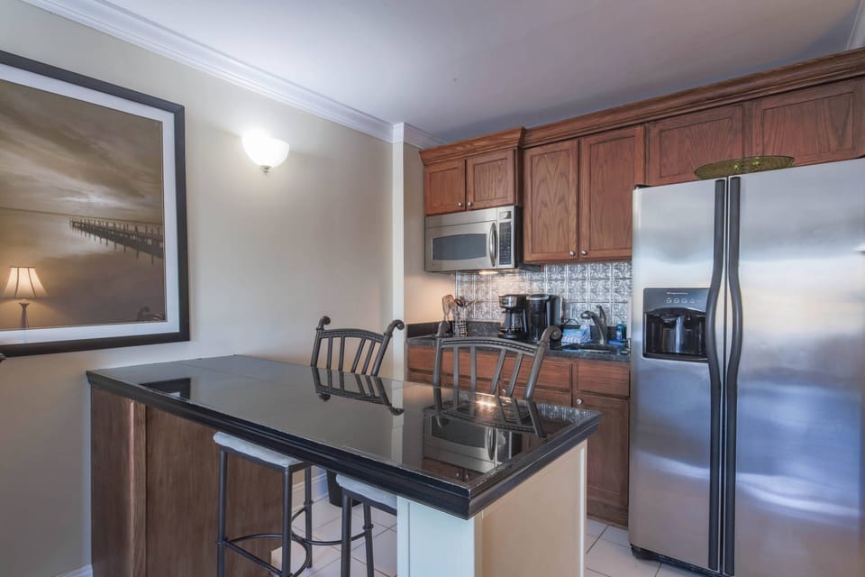 Ketch Studio features a kitchenette with refrigerator, cooktop, microwave, sink and coffee maker.
