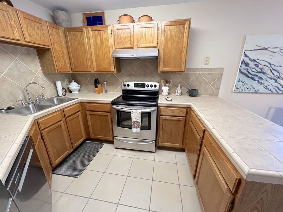 New appliances and generous counter space and cabinets in kitchen.