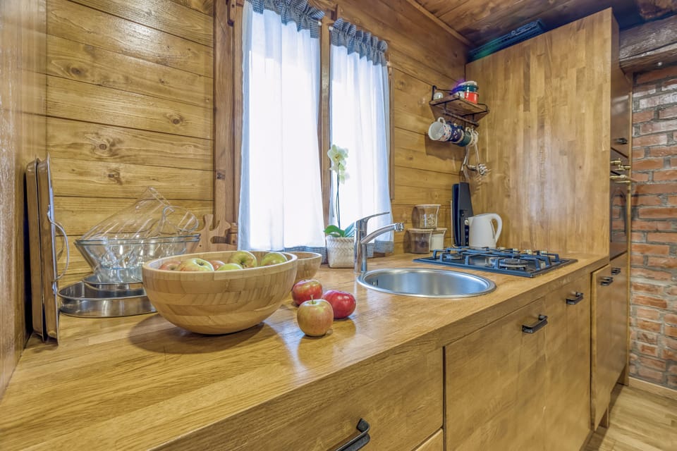 Family House, 3 Bedrooms, Fireplace, Mountainside (Eco House Lina With Hot Tub and Sauna) | Private kitchen | Stovetop, electric kettle, dining tables