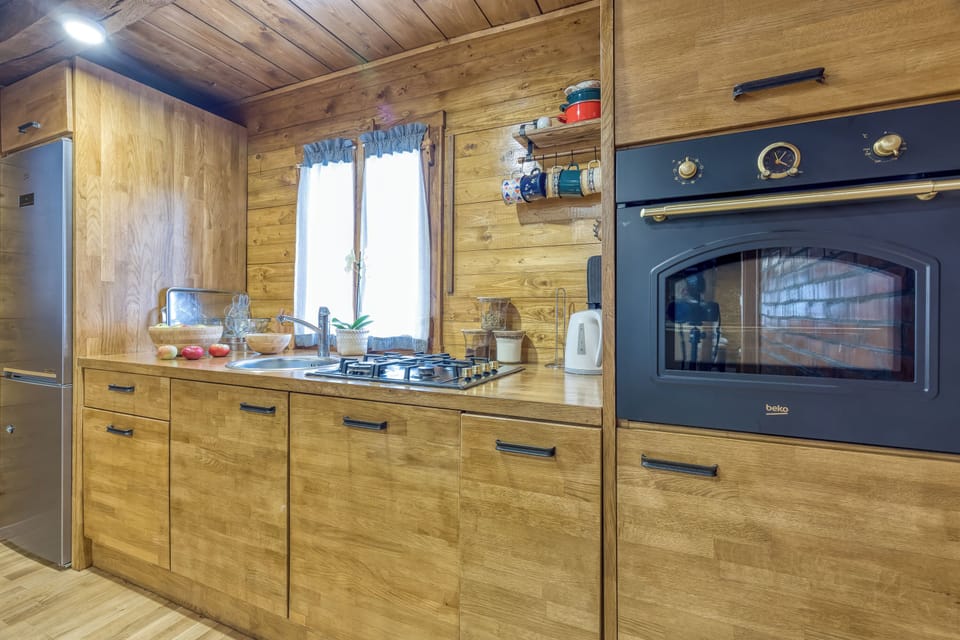 Family House, 3 Bedrooms, Fireplace, Mountainside (Eco House Lina With Hot Tub and Sauna) | Private kitchen | Stovetop, electric kettle, dining tables