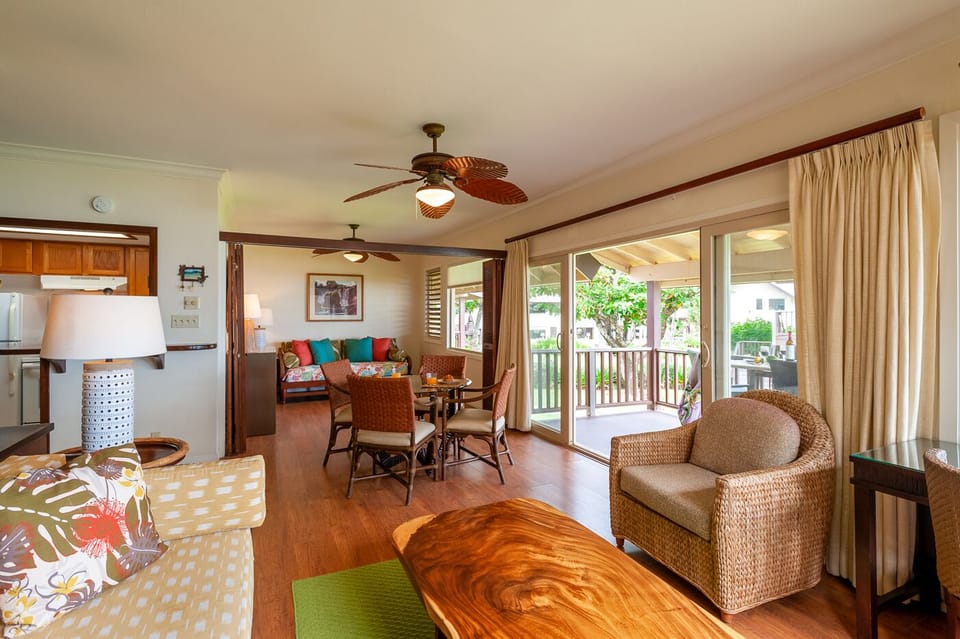 The living and dining areas open up onto the large lanai. Leave the screen door open to let in the breezes, or simply enjoy the view while you eat a meal!