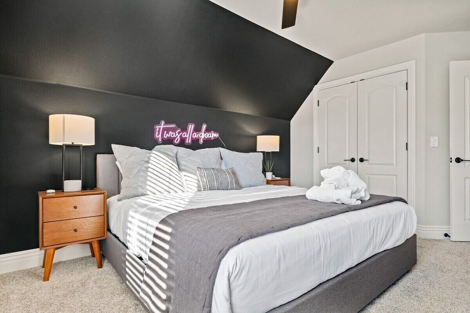Our second King bedroom is complete with a large closet, 49-inch Samsung Smart TV, eye-catching “It Was All a Dream" LED lights and nearby bath.