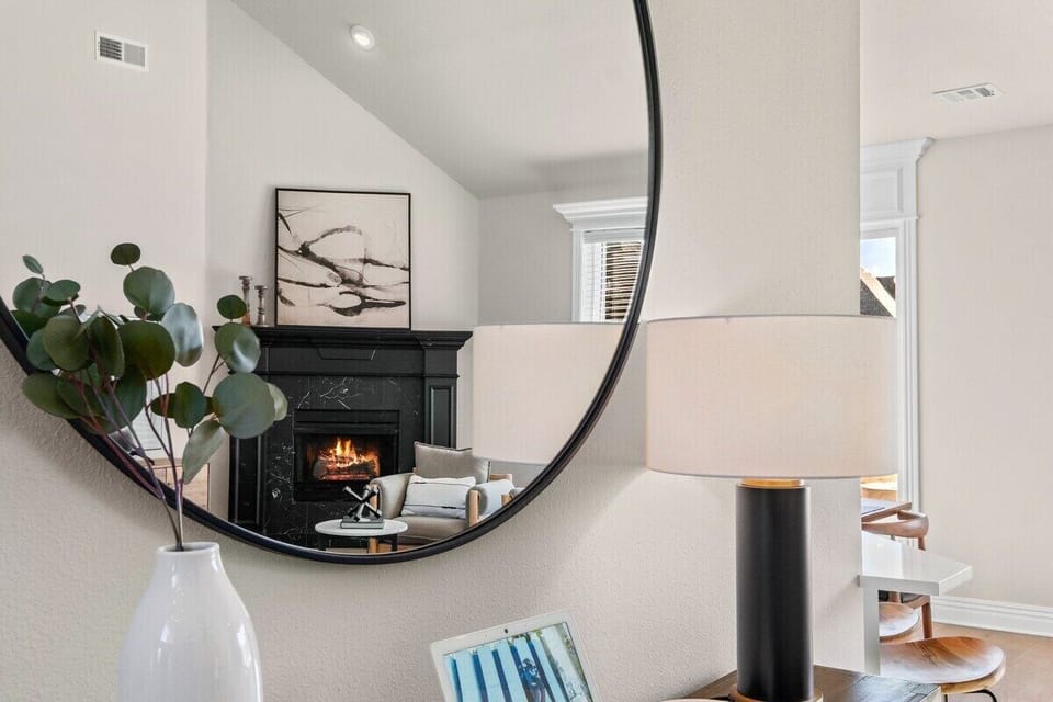 We love this massive mirror, which mocks the shape of our chandelier!