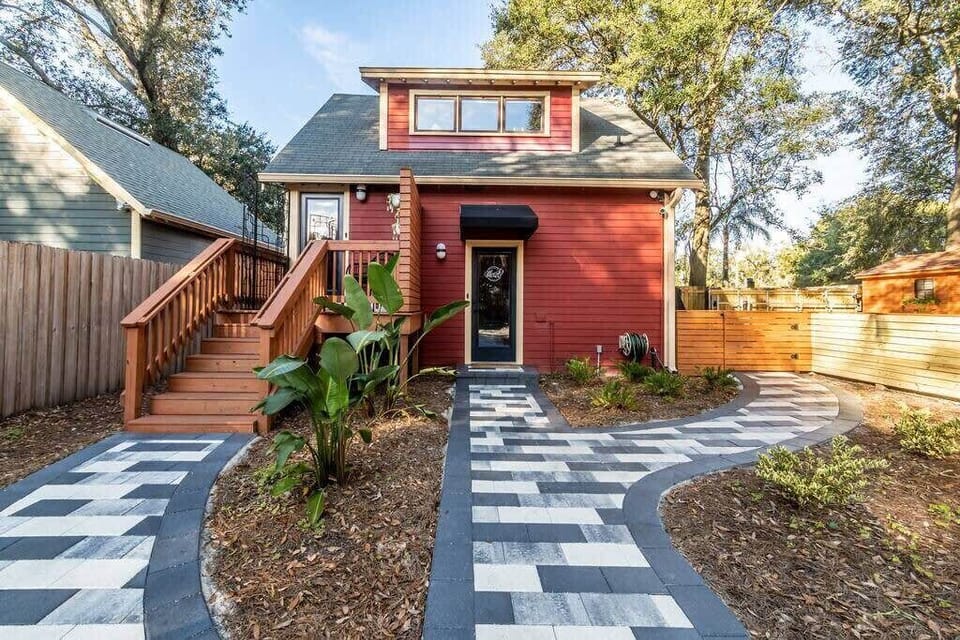 Exterior view of House of Meesh. The Clubhouse is downstairs (door to right) and the Loft is upstairs (door to left). Off-street, gated parking is to the right of the building.