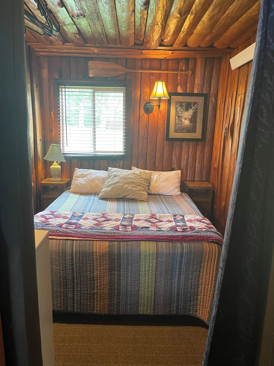Cabin 5 - queen bed, upper shelf, hanging rod, lamp, window
