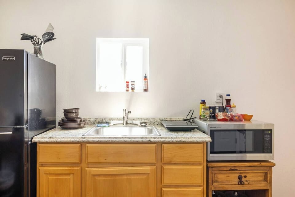 Kitchenette off the master bedroom could also be used as a home office if you're working while on the road.