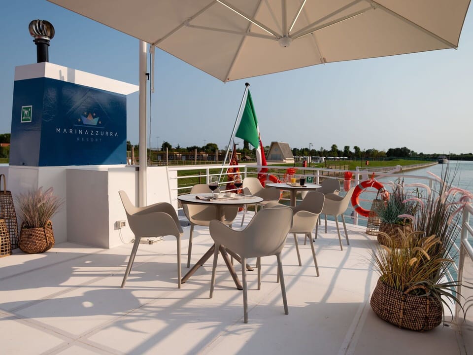 Sky, Table, Plant, Property, Furniture, Umbrella, Building, Chair, Azure, Shade