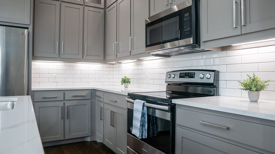 Kitchen includes an electric stove top perfect to make any meal.