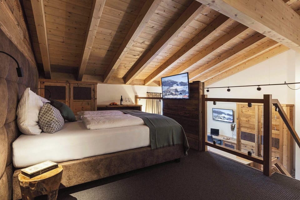 Mezzanine suite, balcony, mountain view | Hypo-allergenic bedding, in-room safe, free WiFi, bed sheets