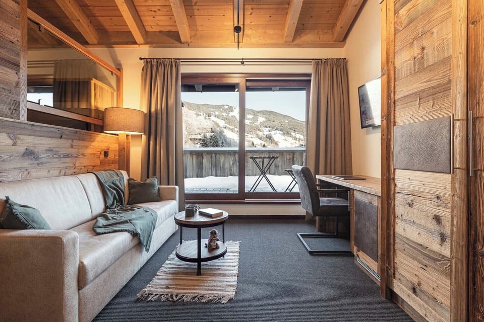 Mezzanine suite, balcony, mountain view | Living area | 32-inch LCD TV with cable channels