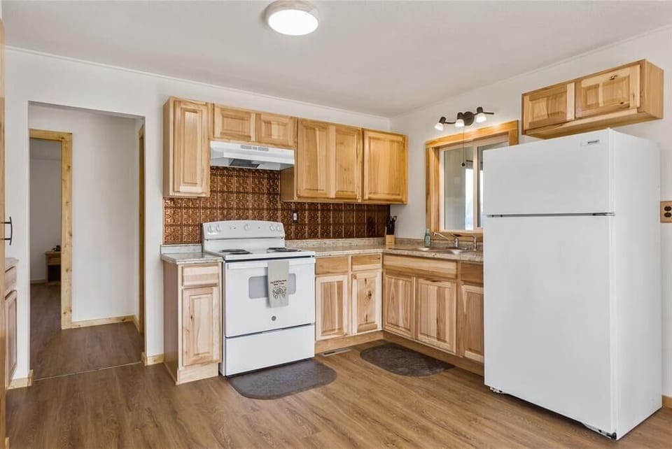 Full size fridge and stove/oven and nice view of the Big Horn Mountains.