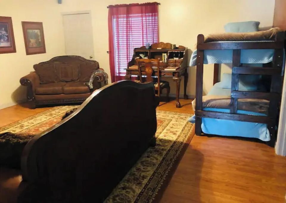 Bunk bed set in living room for extra sleep area.