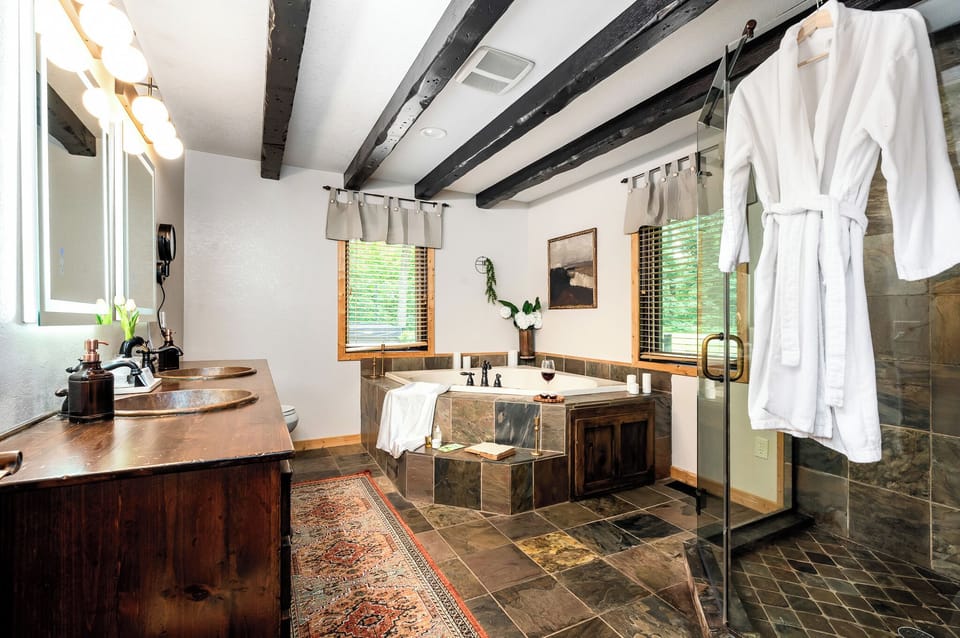 Main floor bathroom with jetted tub and beautiful glass shower