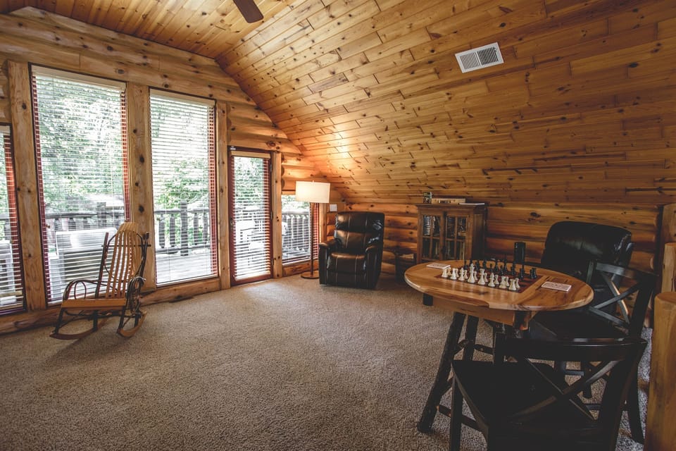 Two electric recliners to take a quick nap while sitting in the loft with the view of the front and back of the home