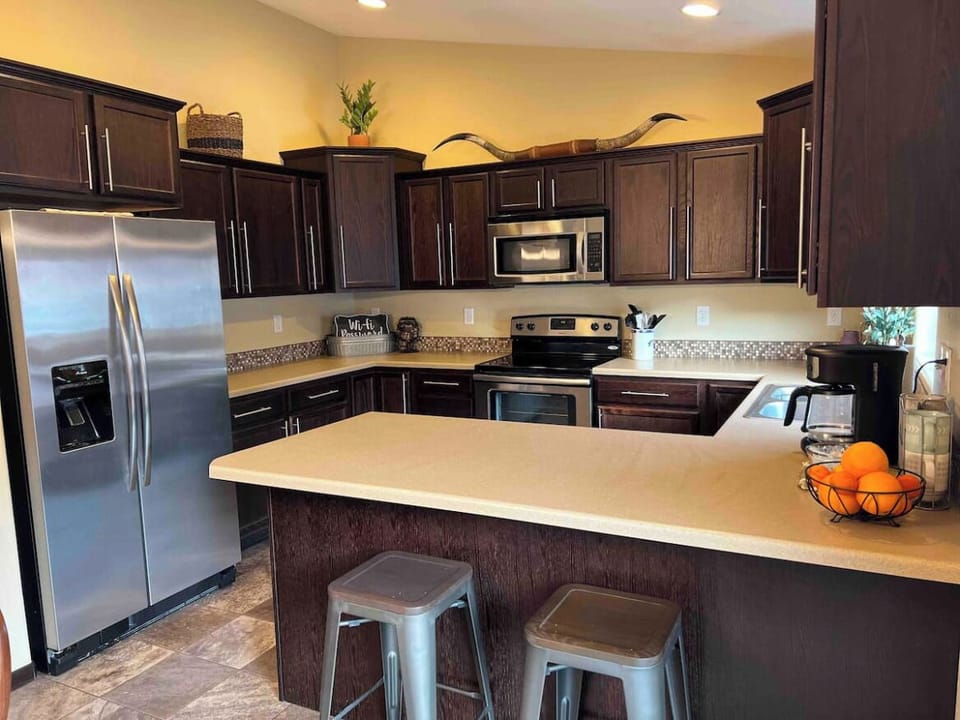 Modern kitchen with extra seating at the bar.
