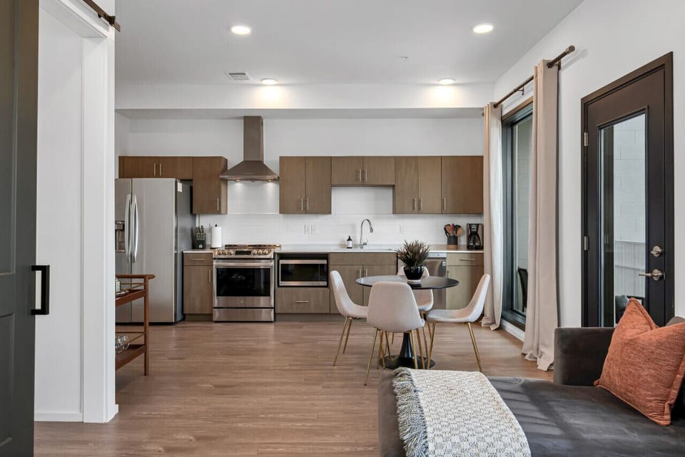 The kitchen opens up into the living room. Watch your favorite show on our smart TV. The sofa turns into a pullout couch. Queen air mattress also available!