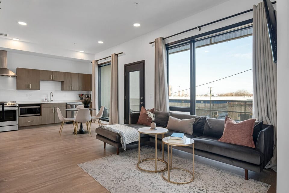 The kitchen opens up into the living room. Watch your favorite show on our smart TV. The sofa turns into a pullout couch. Queen air mattress also available!