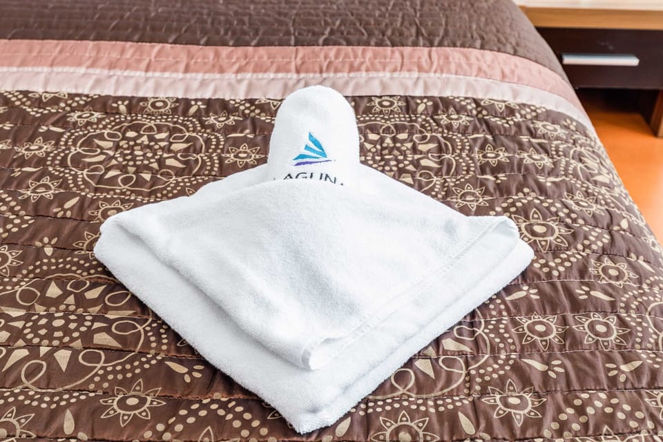 Close-up of the towel on the bed. 