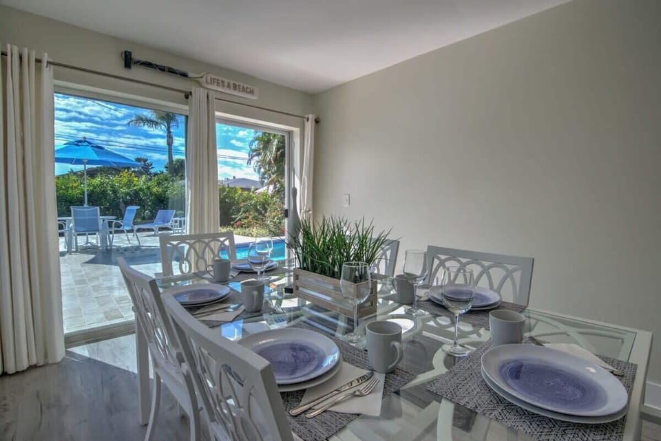 The Dining Room is Just Off of the Kitchen and Has a Slider to the Lanai and Pool