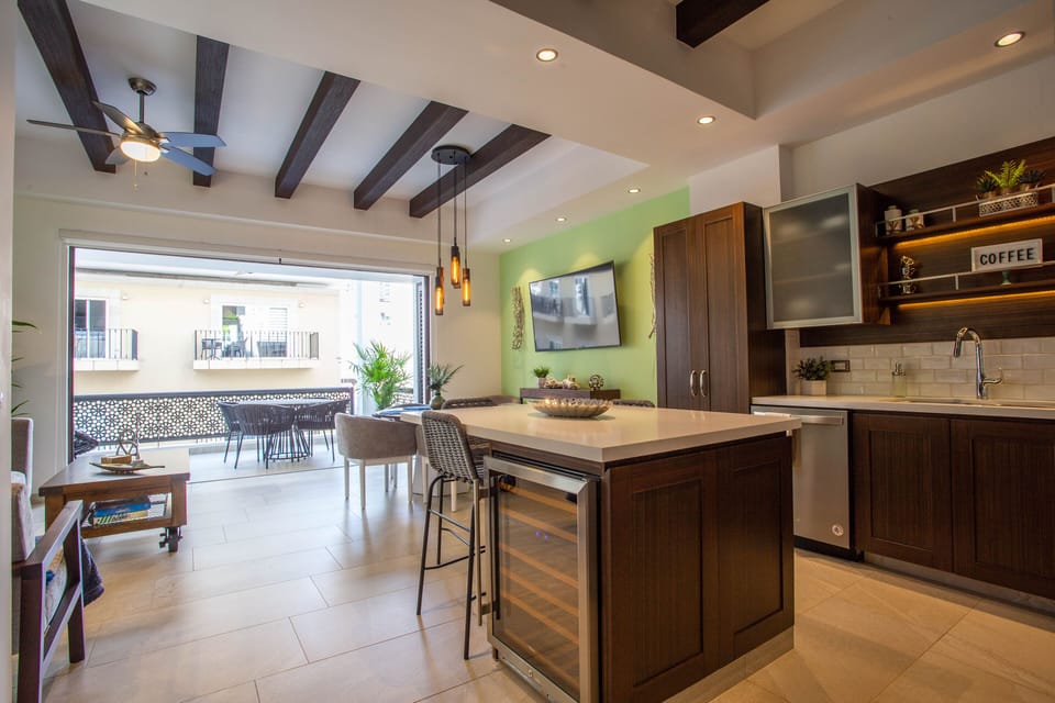 The kitchen has a bar and seating for 2
