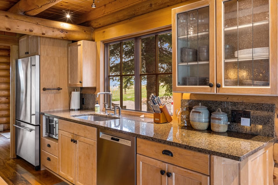 Full kitchen with stainless steel appliances.