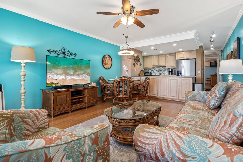 Sink into comfortable island-style seating and let the endless blue horizon wash away your worries through expansive glass doors that frame paradise.