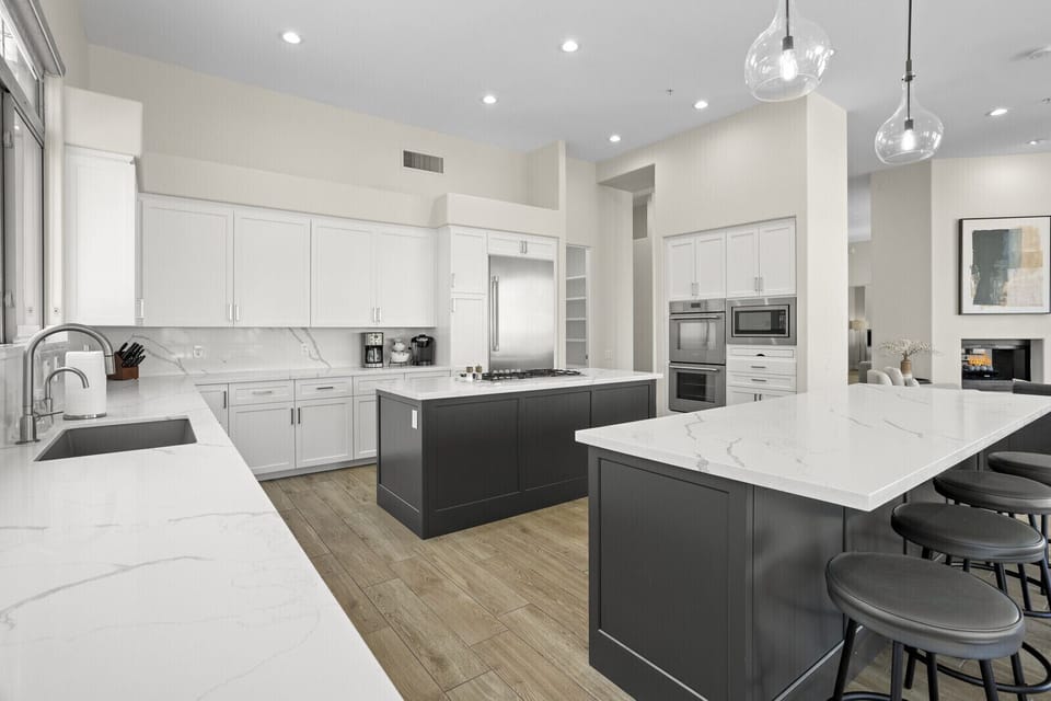 Spacious double island kitchen with open floor plan and beautiful views 
