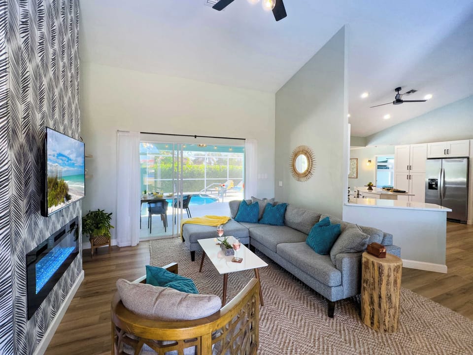 Enter to the spacious living room as the pool winks at you...