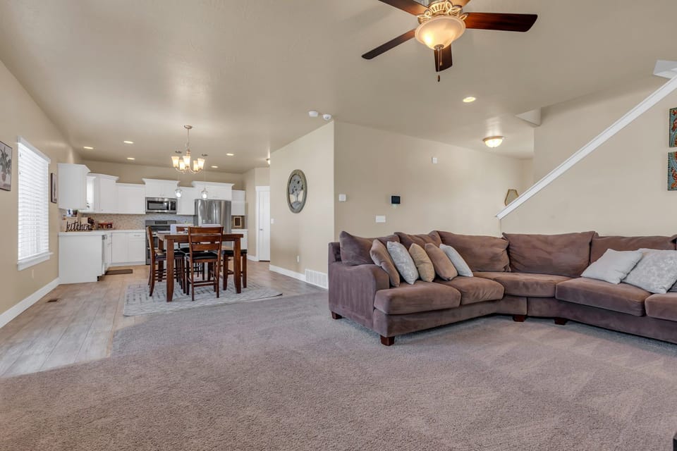 Living room shot with a view of the dining room/kitchen area.