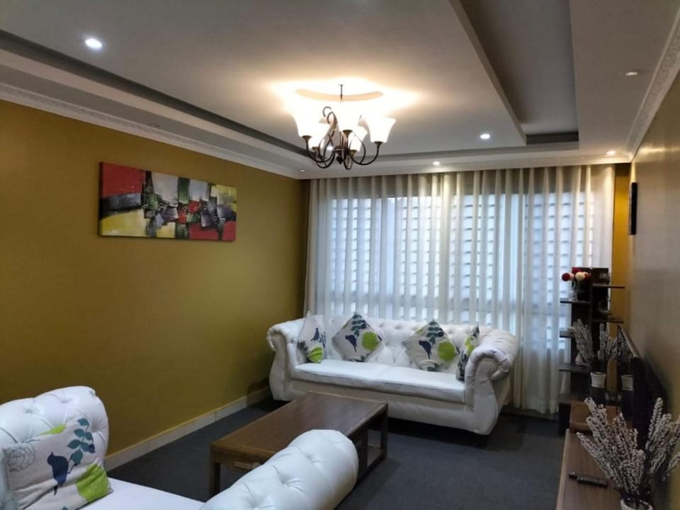 Standard Apartment | Living area | 32-inch TV with cable channels